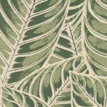 Detail of wallpaper in a large-scale leaf print in shades of green on a tan field.