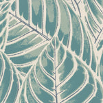 Detail of wallpaper in a large-scale leaf print in shades of blue and turquoise on a tan field.