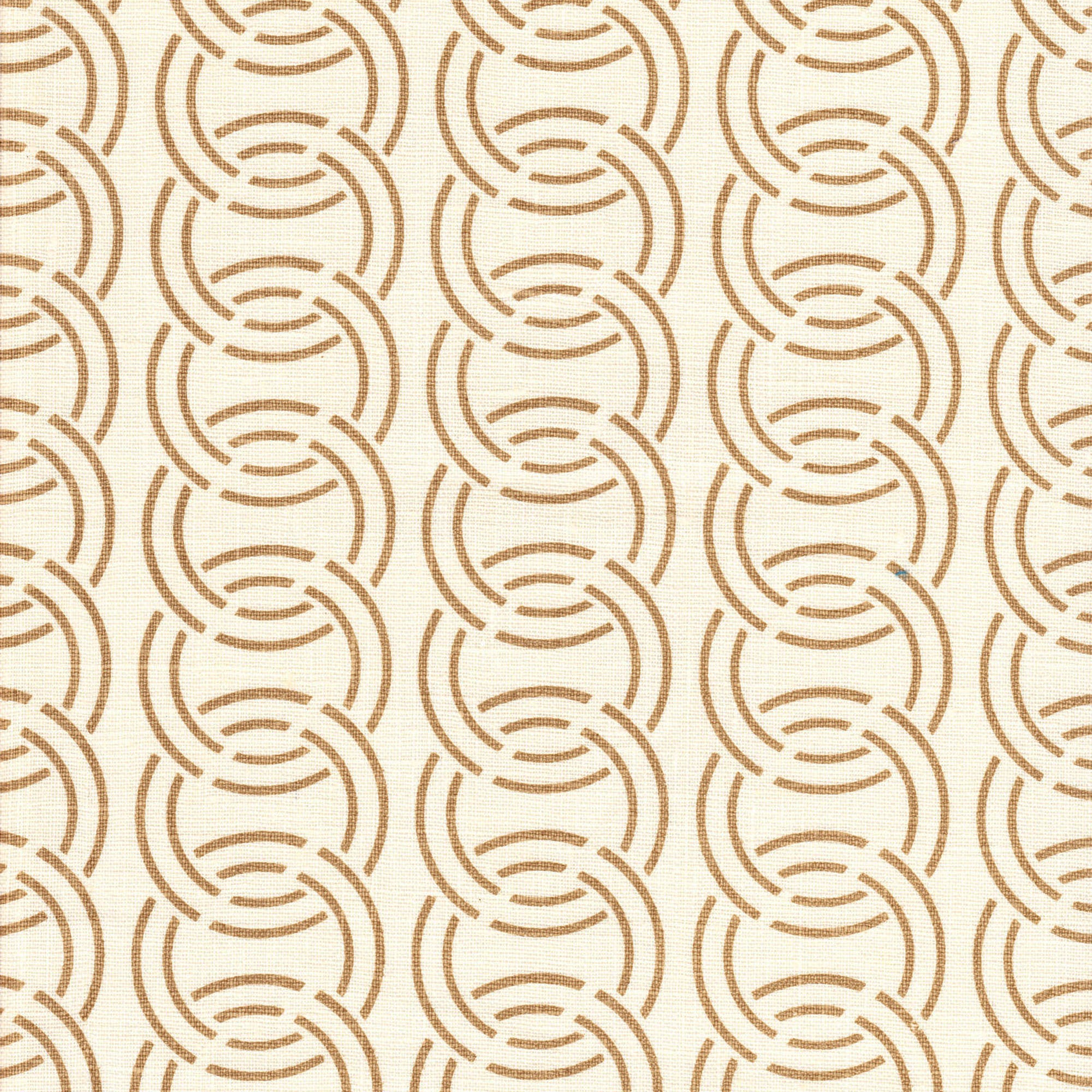 Detail of fabric in an interlocking circular pattern in brown on a cream field.