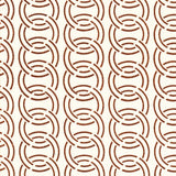 Detail of fabric in an interlocking circular pattern in brown on a cream field.