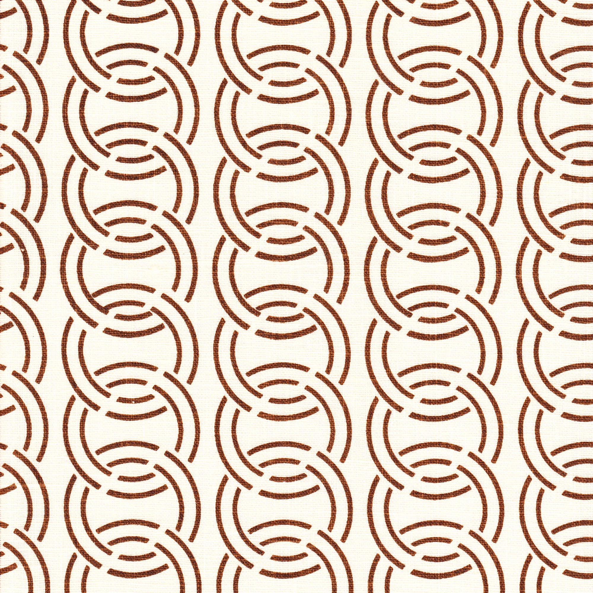 Detail of fabric in an interlocking circular pattern in brown on a cream field.