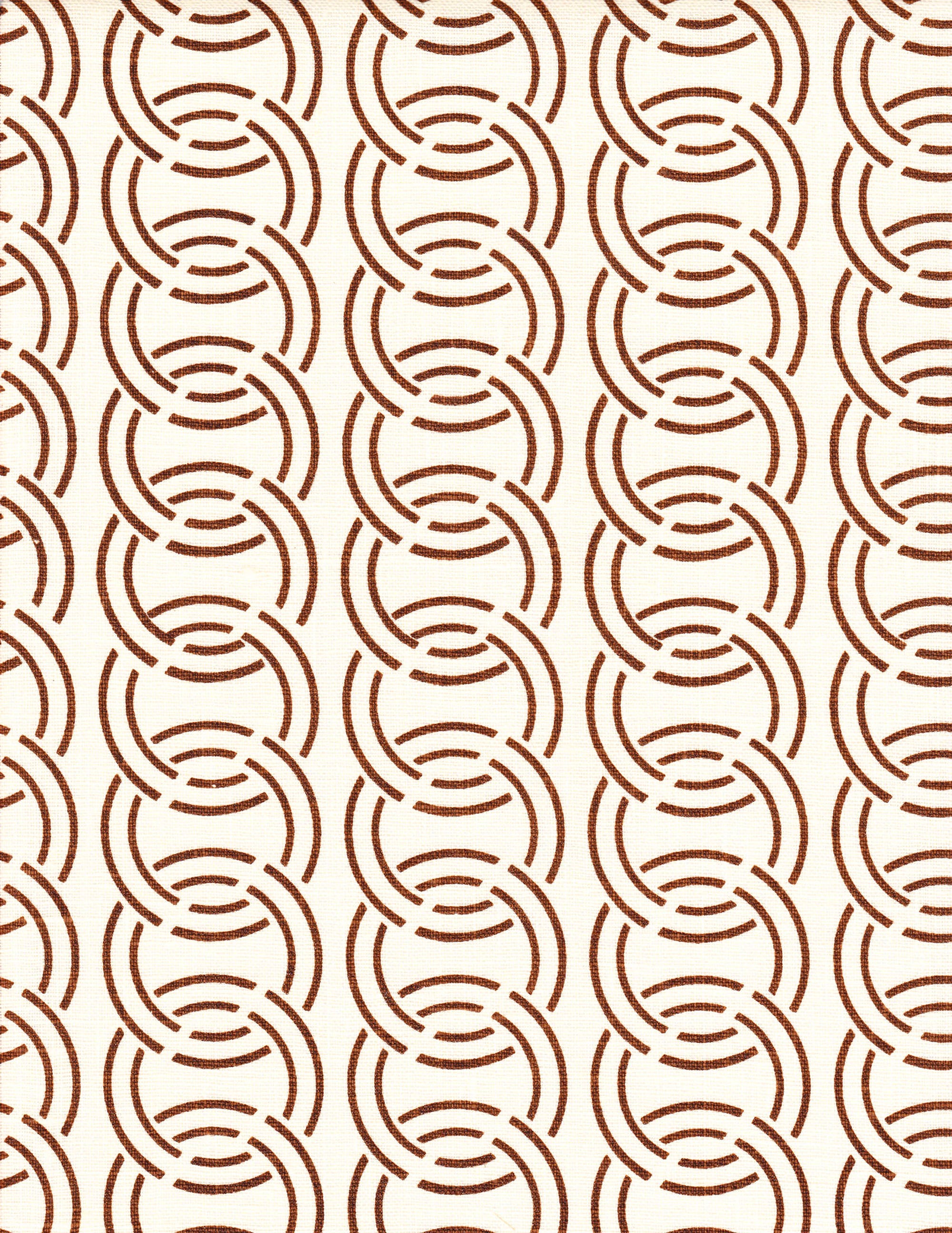 Detail of fabric in an interlocking circular pattern in brown on a cream field.