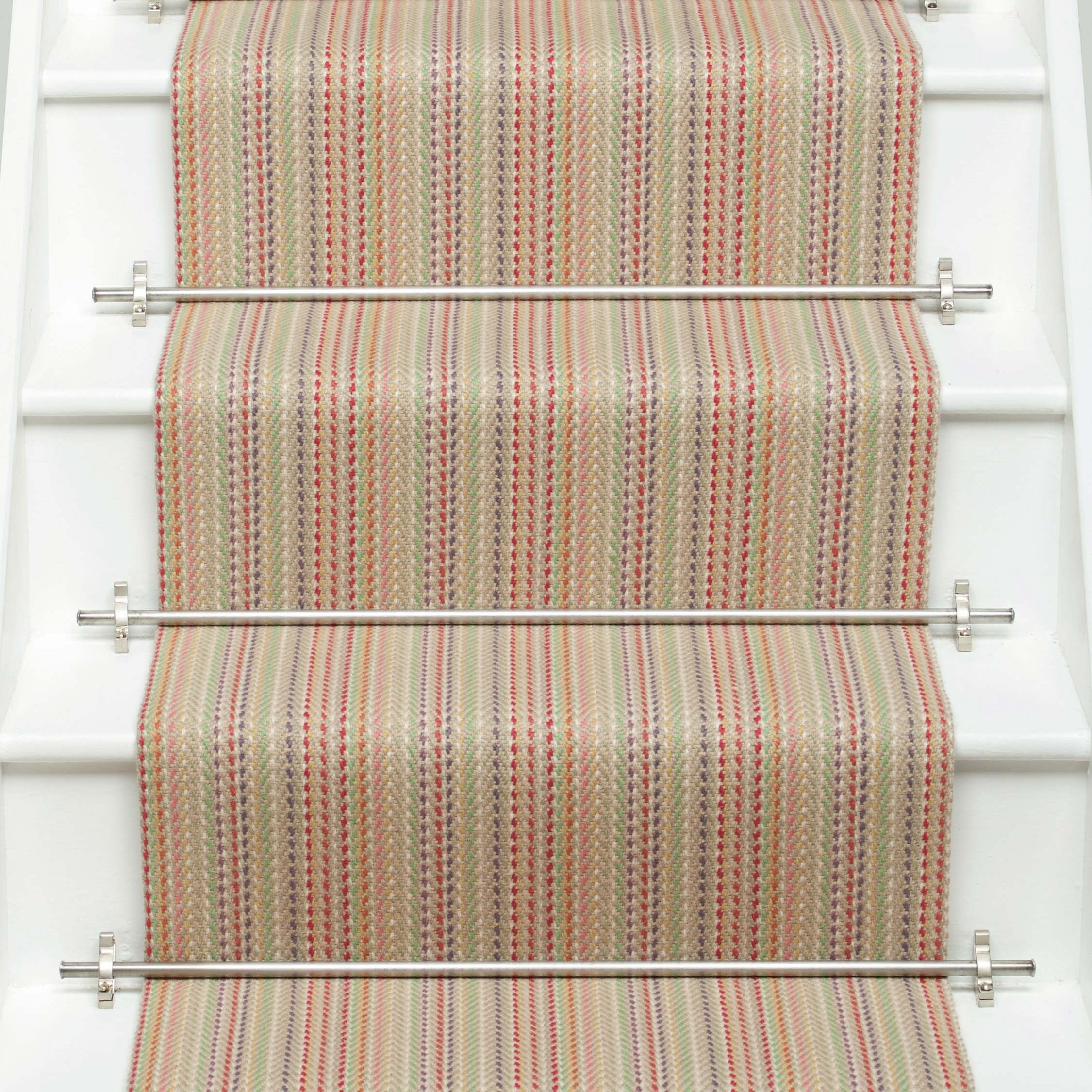 Striped flatweave runner in red green blue orange on white staircase