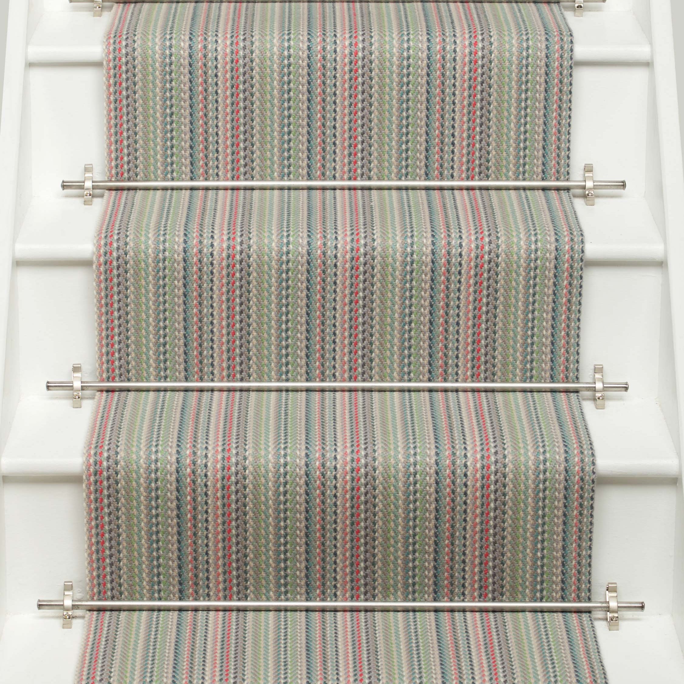 Striped flatweave runner in green pink blue red on white staircase