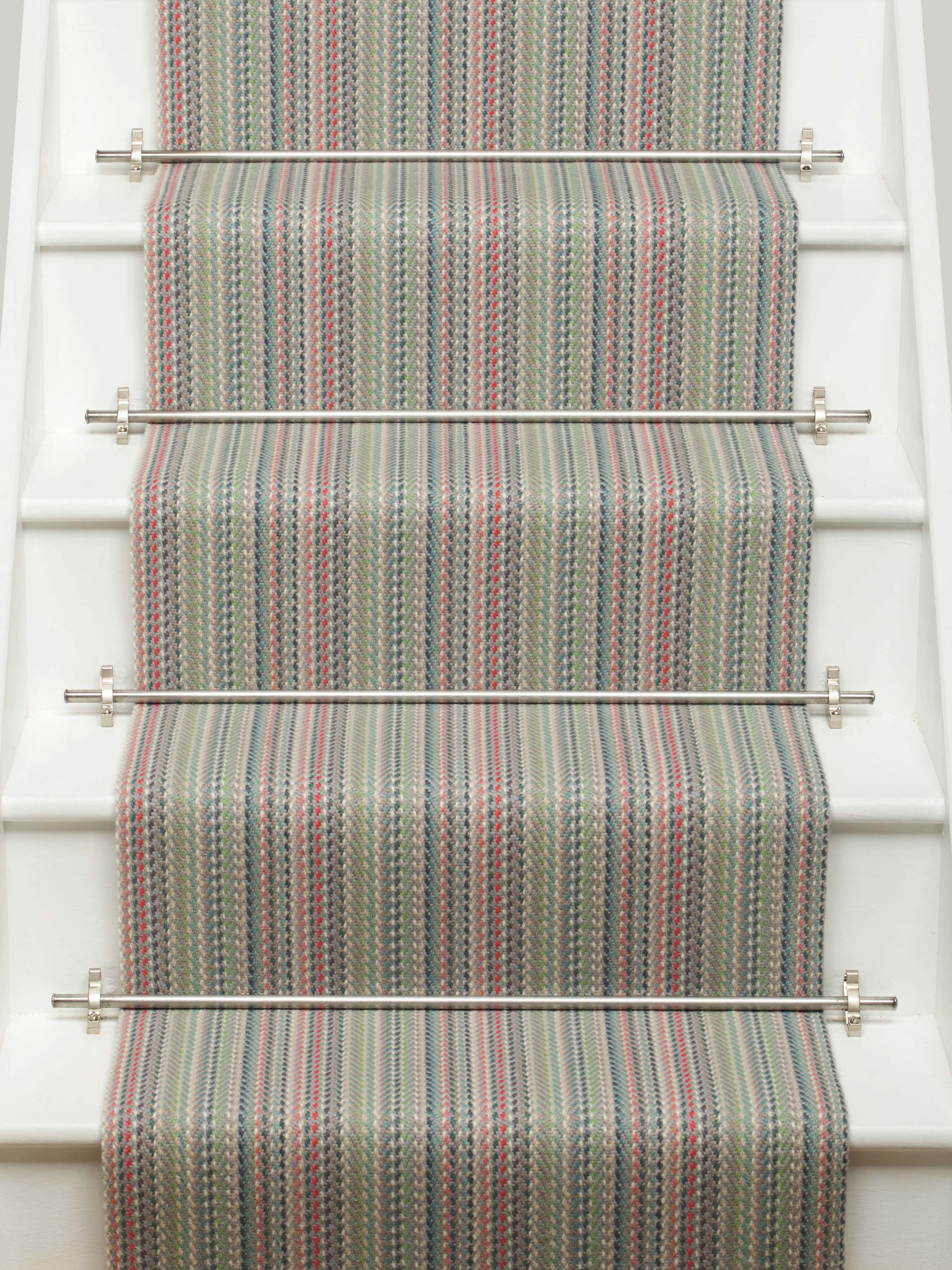 Striped flatweave runner in green pink blue red on white staircase