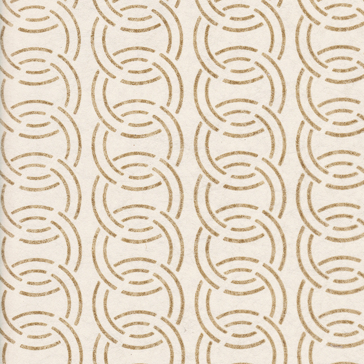 Detail of wallpaper in an interlocking circular pattern in mottled brown on a cream field.