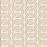 Detail of wallpaper in an interlocking circular pattern in mottled brown on a cream field.