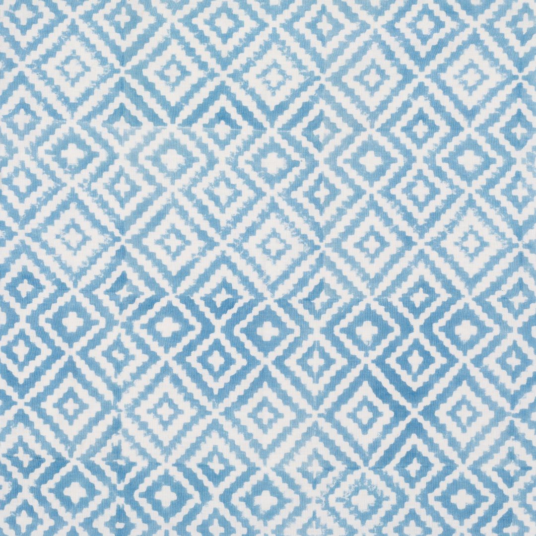 Detail of fabric in a geometric diamond print in light blue on a white field.