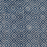 Detail of fabric in a geometric diamond print in navy on a cream field.