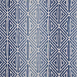 Broadloom carpet with triangle pattern with an ombré background in shades of blue. 