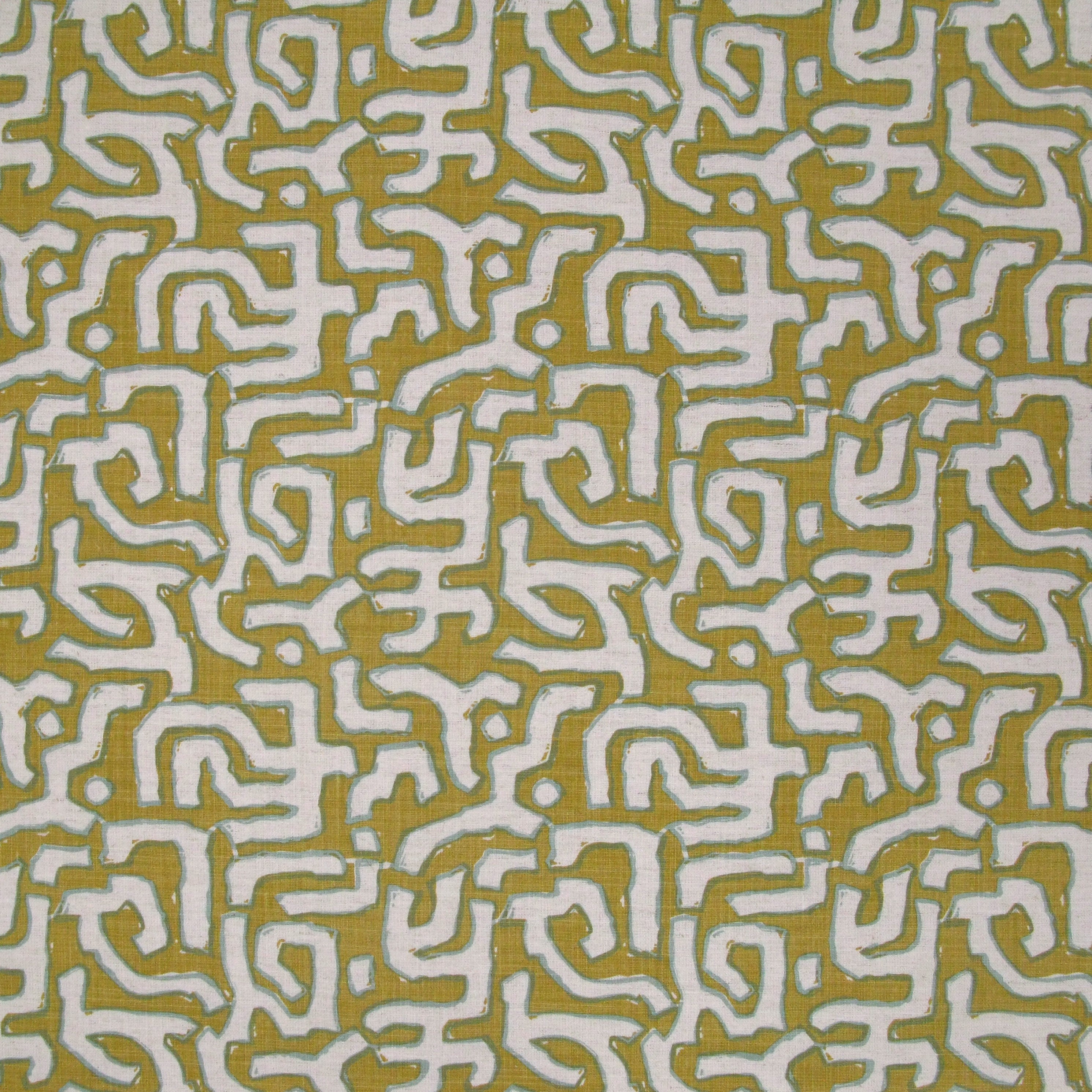 Fabric in an abstract meandering shape print in white and sage on a mustard field.