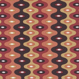 Detail of fabric in a playful curving stripe print in shades of red, mustard and brown.