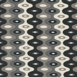 Detail of fabric in a playful curving stripe print in shades of gray and white.