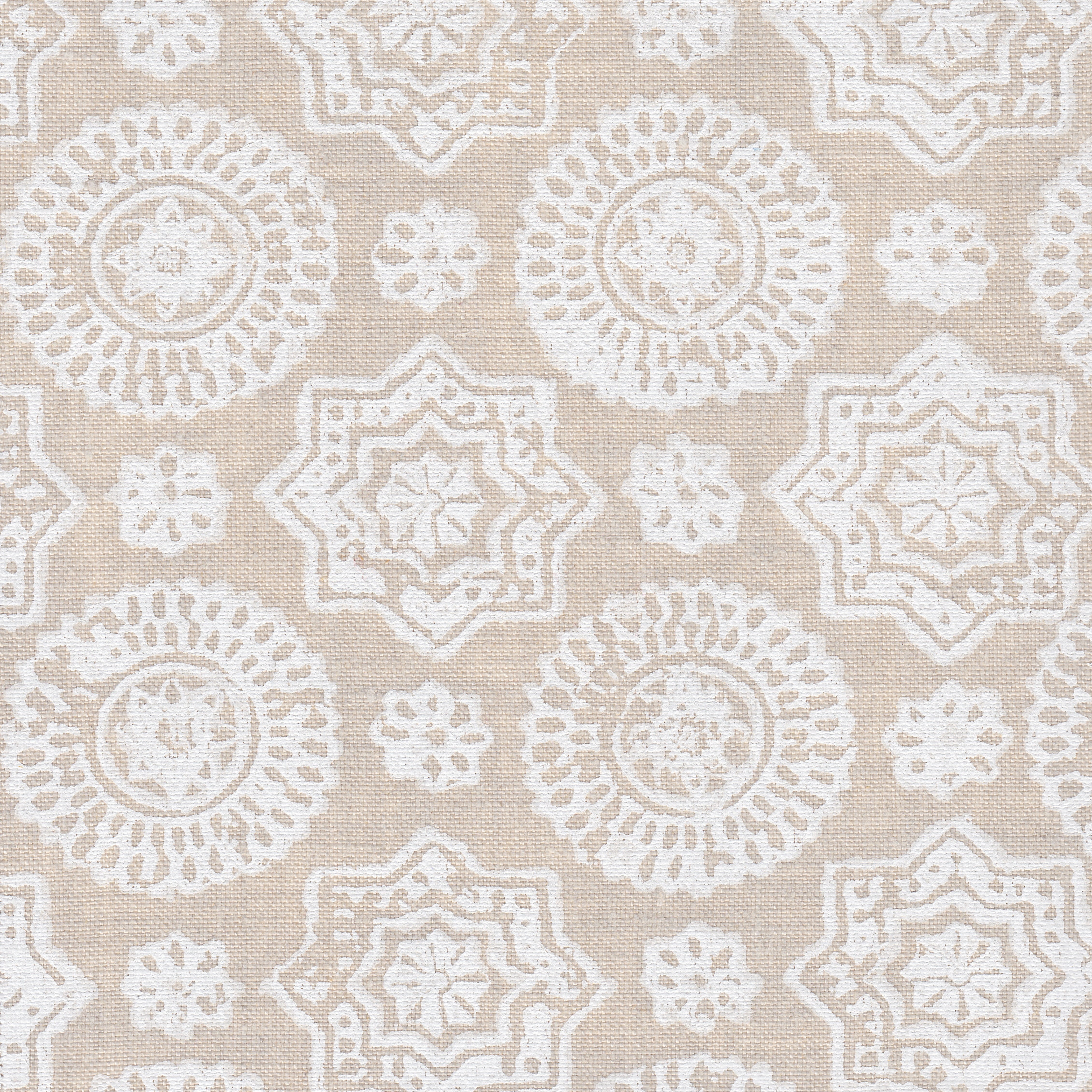 Detail of fabric in a geometric damask print in shades of cream on a tan field.