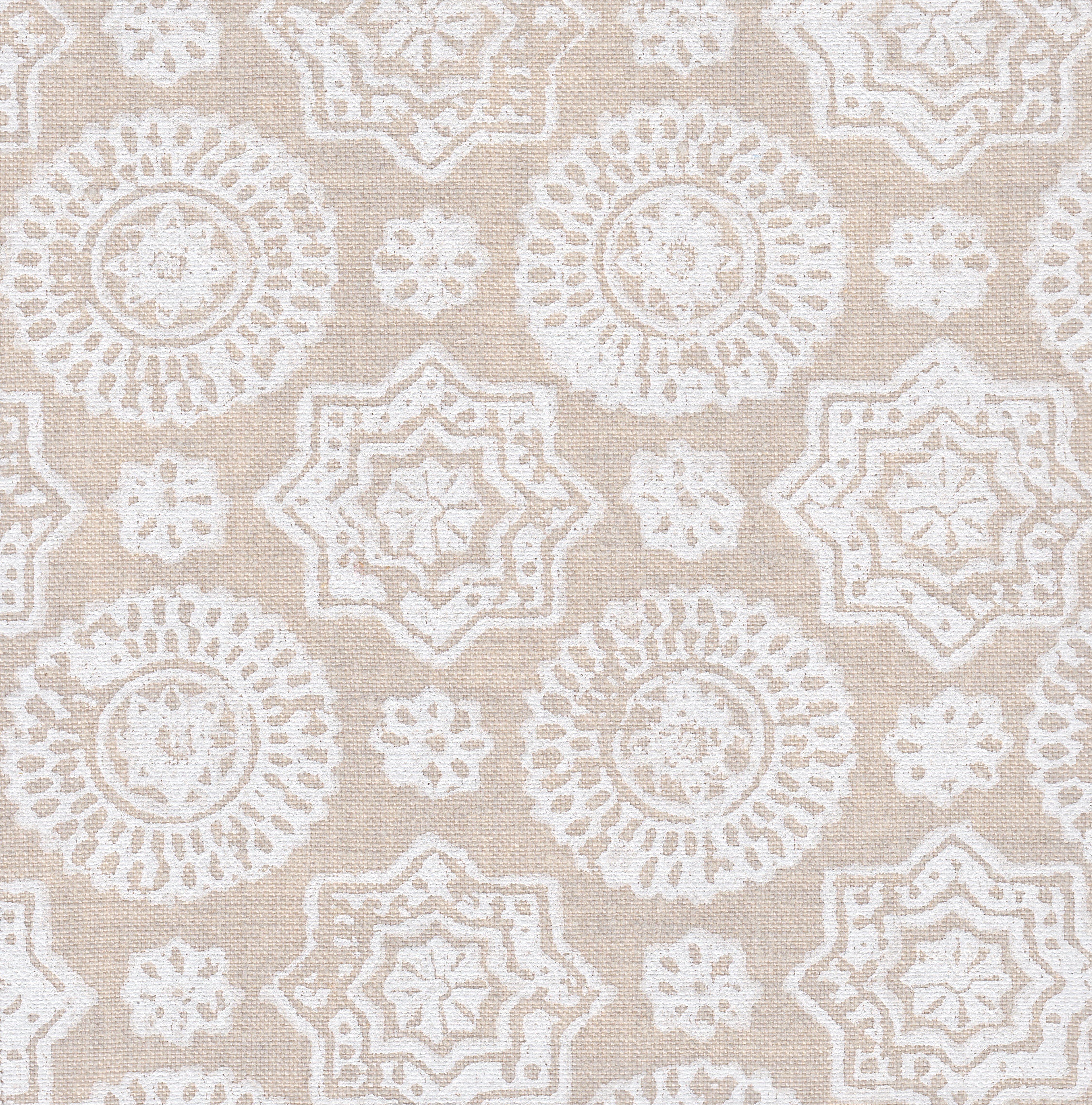 Detail of fabric in a geometric damask print in shades of cream on a tan field.