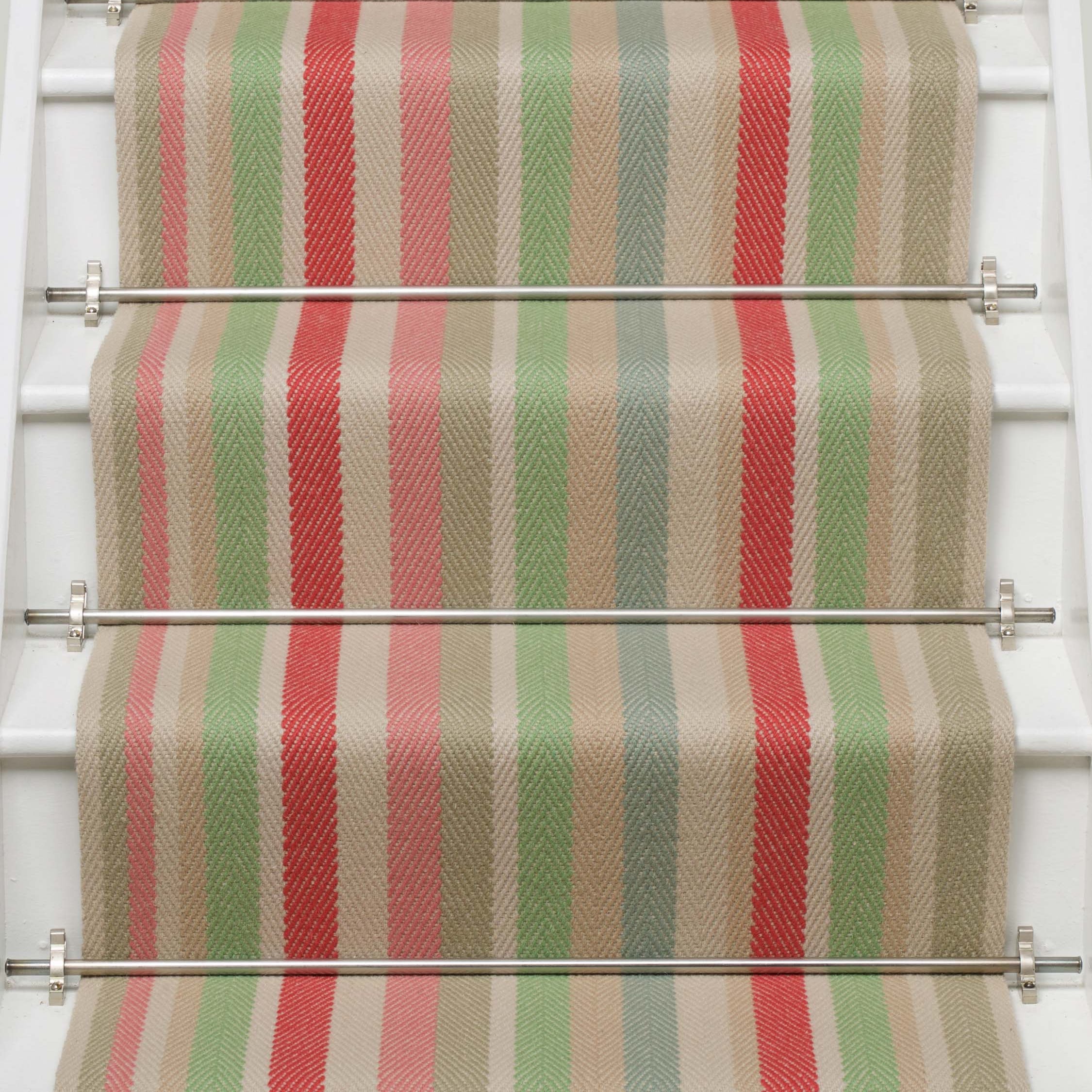 Striped flatweave runner in green pink blue red yellow on white staircase