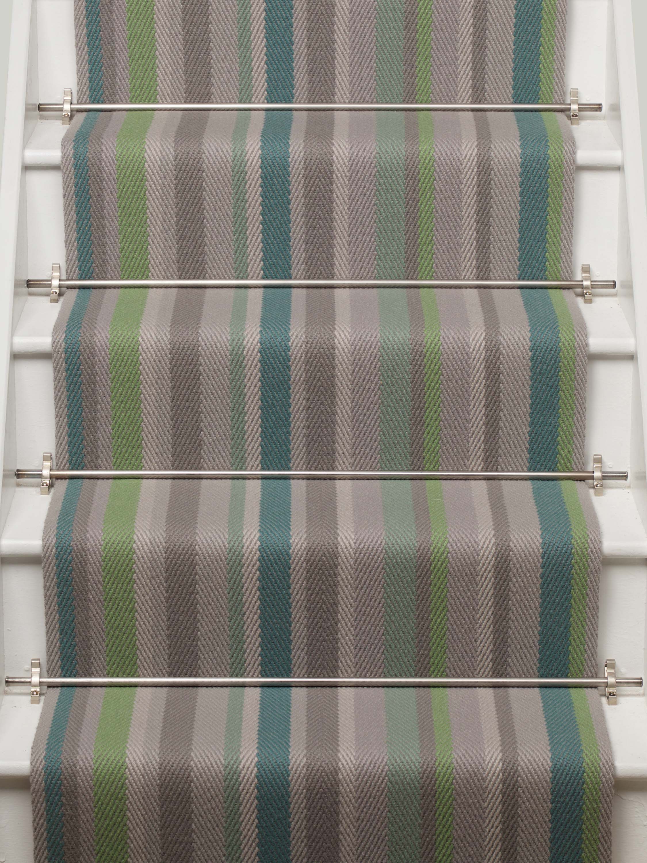 Striped flatweave runner in green blue grey on white staircase