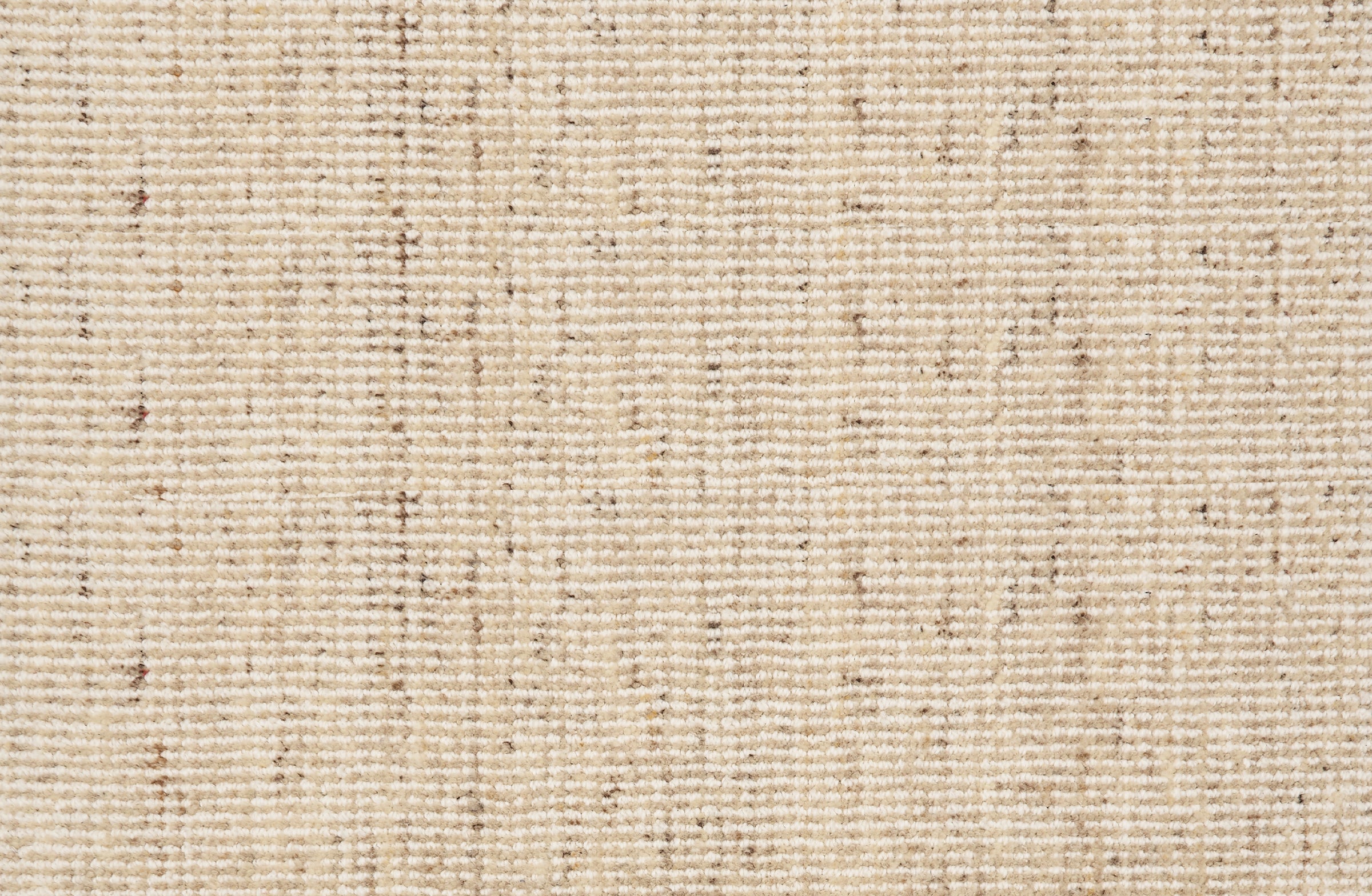 Broadloom carpet in a textural strie in cream accented with brown.