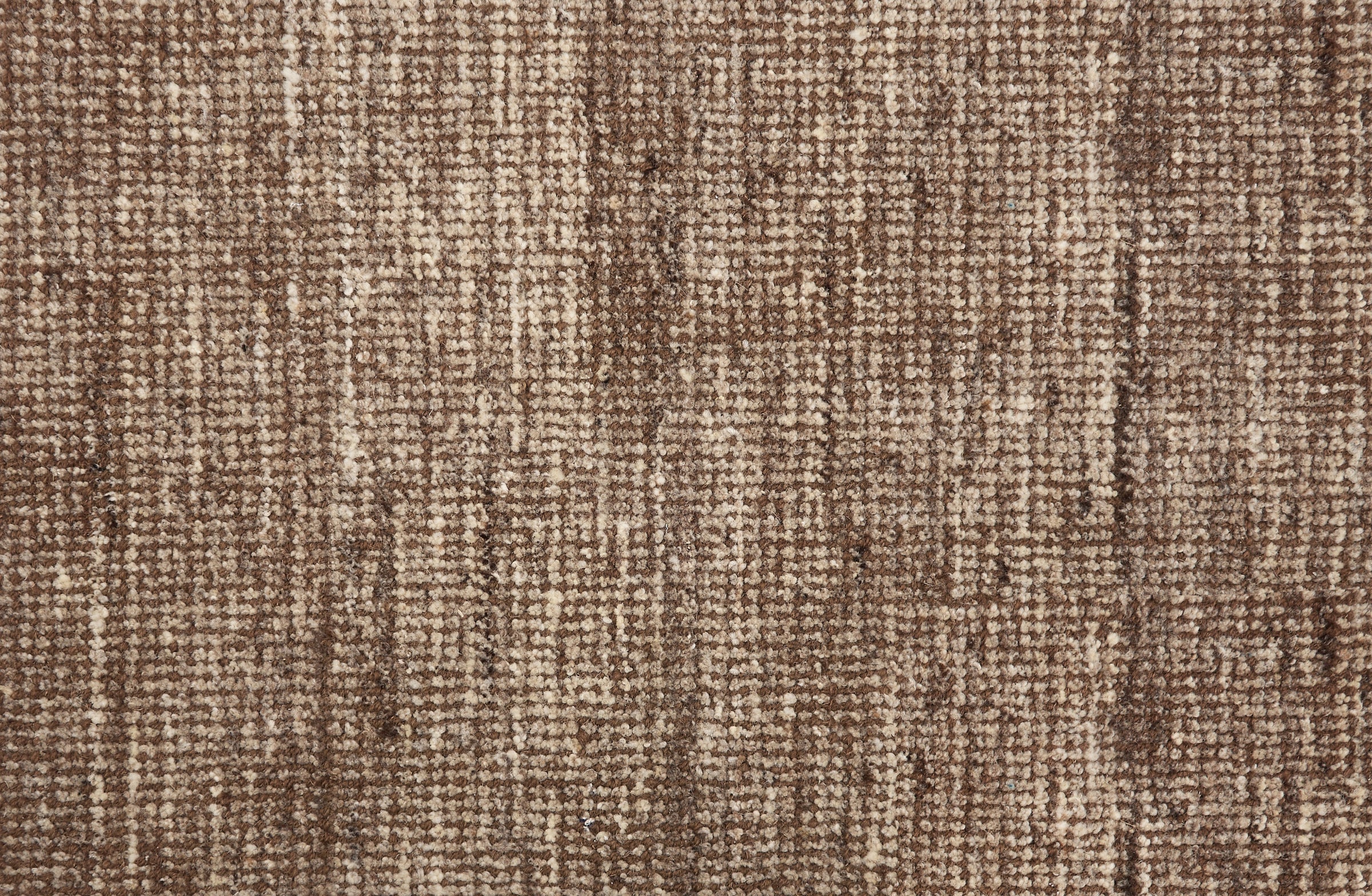 Broadloom carpet in a textural strie in shades of brown.