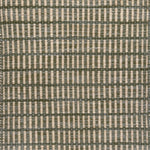 Textured rug with a sage green and beige  checker pattern