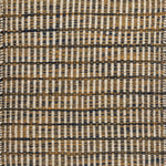 Textured rug with a navy, tan and beige  checker pattern