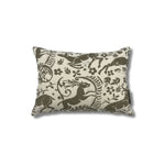 Rectangular throw pillow with a warm grey ram and botanical printed pattern on a cream linen background. 
