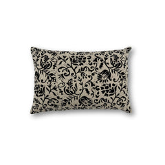 Rectangular throw pillow with a floral scroll filigree pattern in black against a natural linen background. 