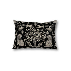 Rectangular throw pillow with a tree at center framed with symetrical lion figures, the back ground is a solid black, the motif is a natural linen color. 