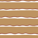Detail of fabric in a wide undulating stripe pattern in red and white on a light brown field.