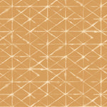 Detail of wallpaper in a mottled lattice print in white on a burnt orange field.