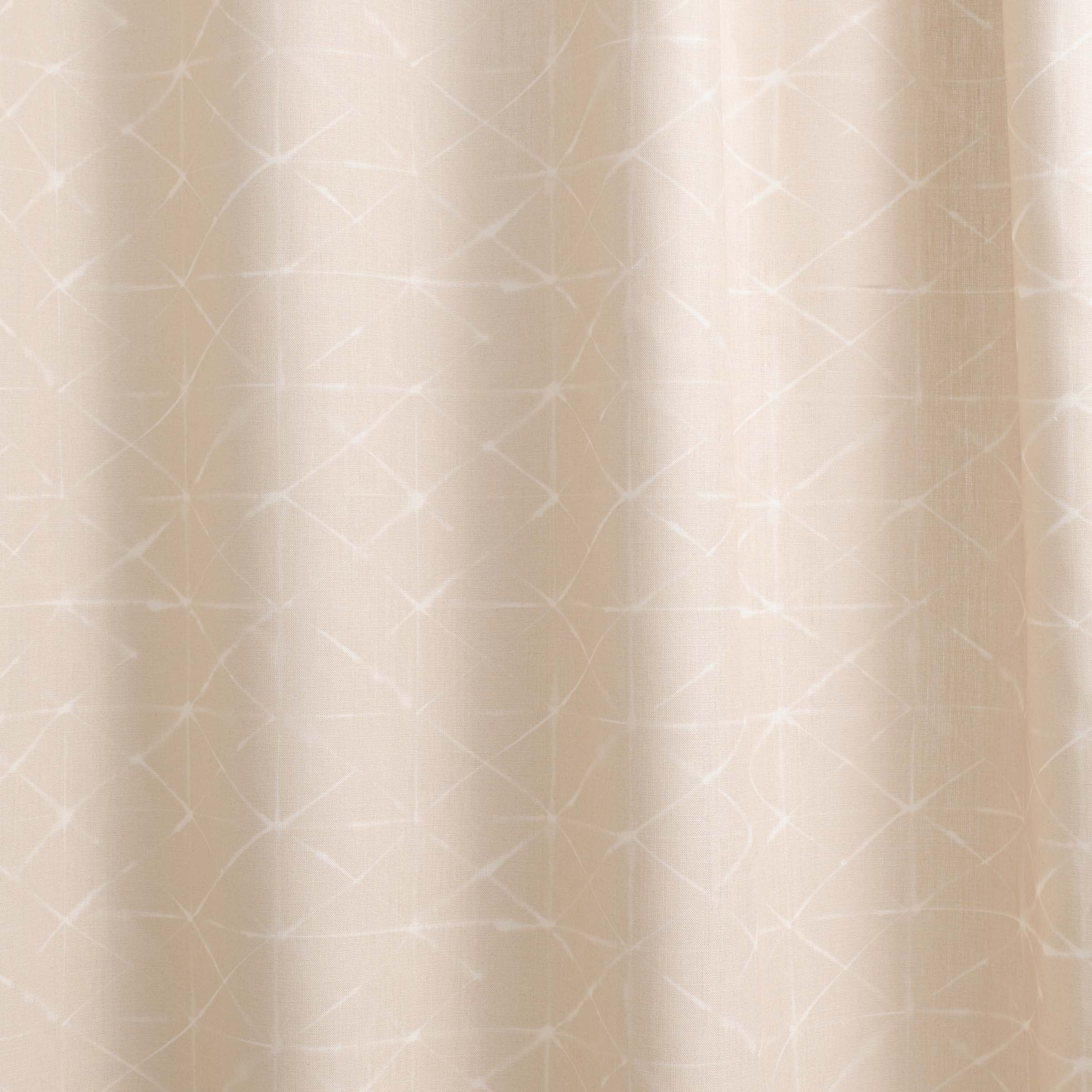 Draped fabric yardage in a mottled lattice print in white on a cream field.