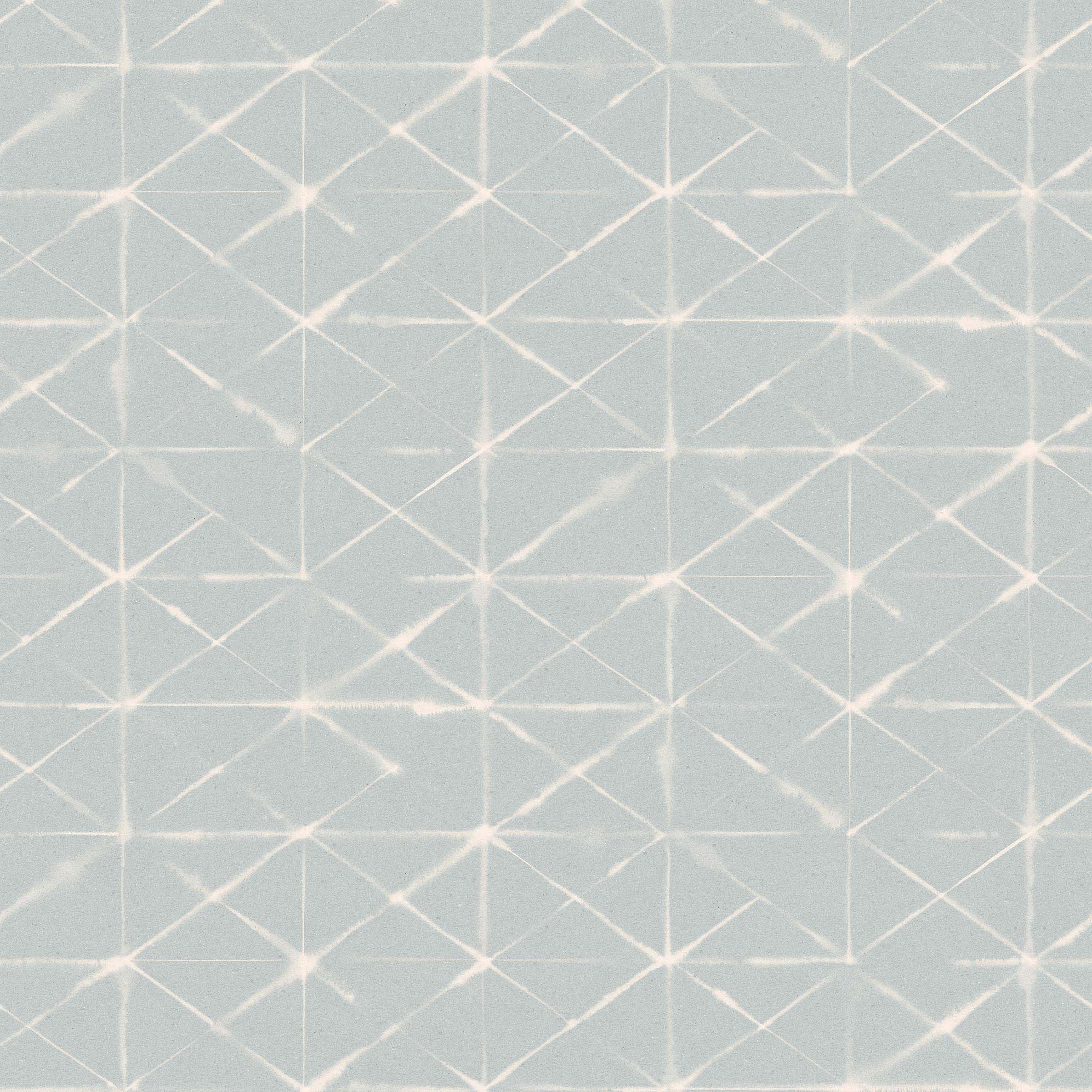 Detail of fabric in a mottled lattice print in white on a light blue field.