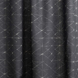 Draped fabric yardage in a mottled lattice print in white on a black field.