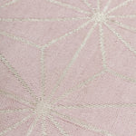 Detail of a geometric patterned carpet with silver lattice design on a light purple background