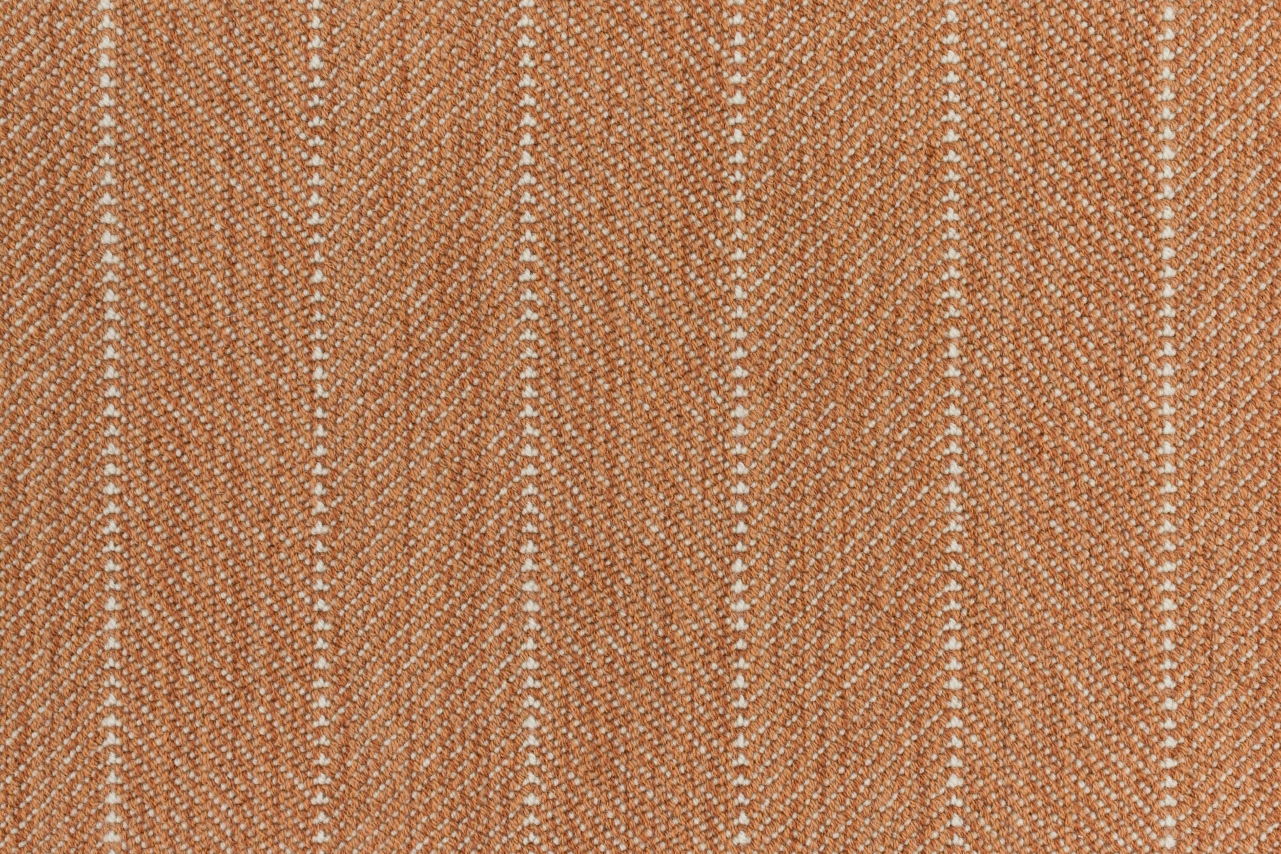 Close-up of a striped herringbone broadloom in orange.