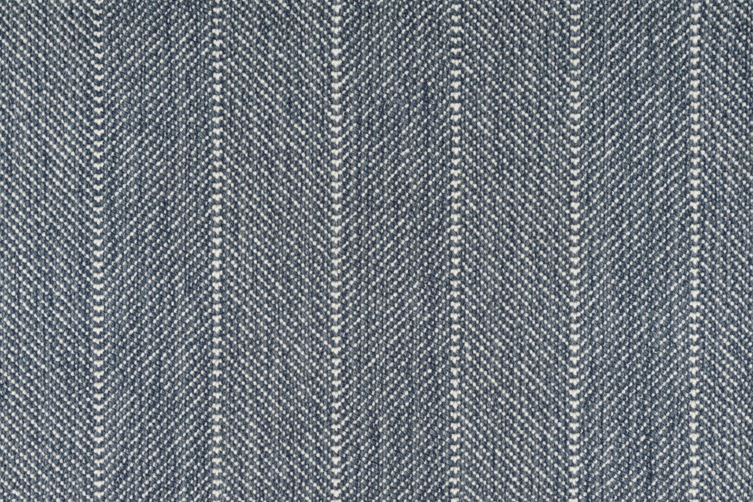Close-up of a striped herringbone broadloom in navy blue.