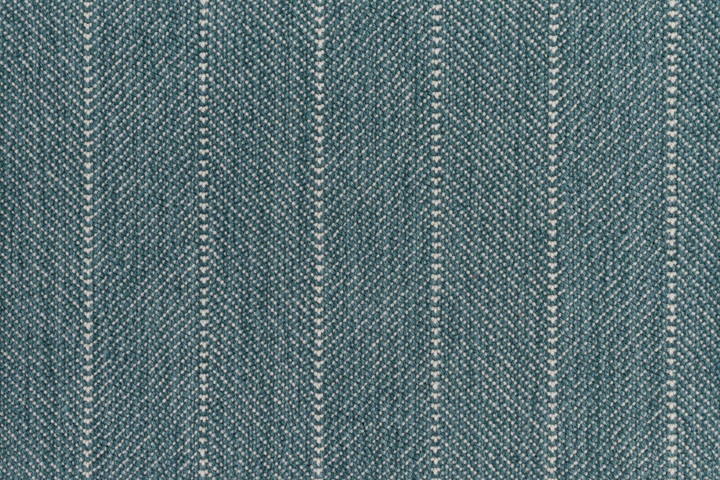 Close-up of a striped herringbone broadloom in teal.