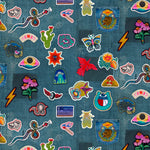Collection of colorful embroidered patches on a denim fabric background