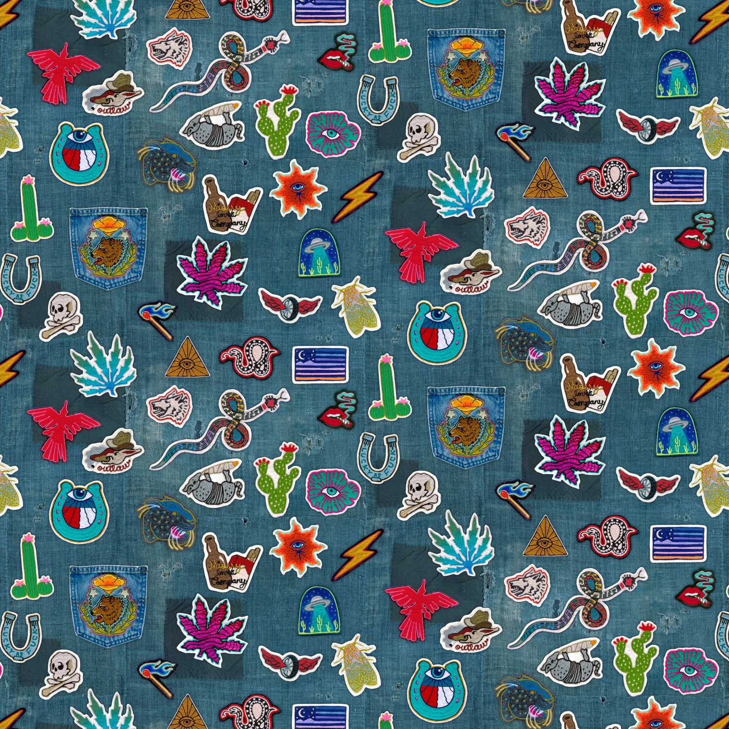 Collection of colorful embroidered patches on a denim fabric background