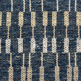 Handwoven rug detail in a contemporary stripe design in blue and cream