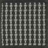 Textured woven outdoor carpet a basketweave design in black and grey.