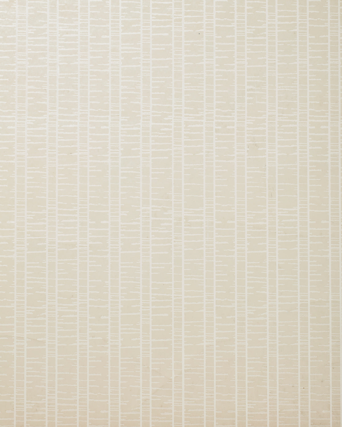 Detail of wallpaper in a textural stripe print in cream.