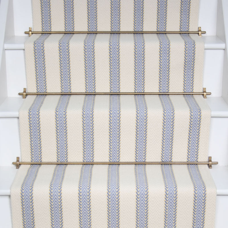 Striped flatweave runner in white and light blue on white staircase