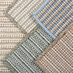 Various broadloom carpet samples in a textural stripe design.