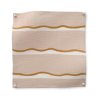 Square fabric swatch in a wide undulating stripe pattern in brown and white on a light pink field.