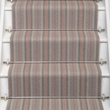 Striped flatweave runner in grey and pink on white staircase