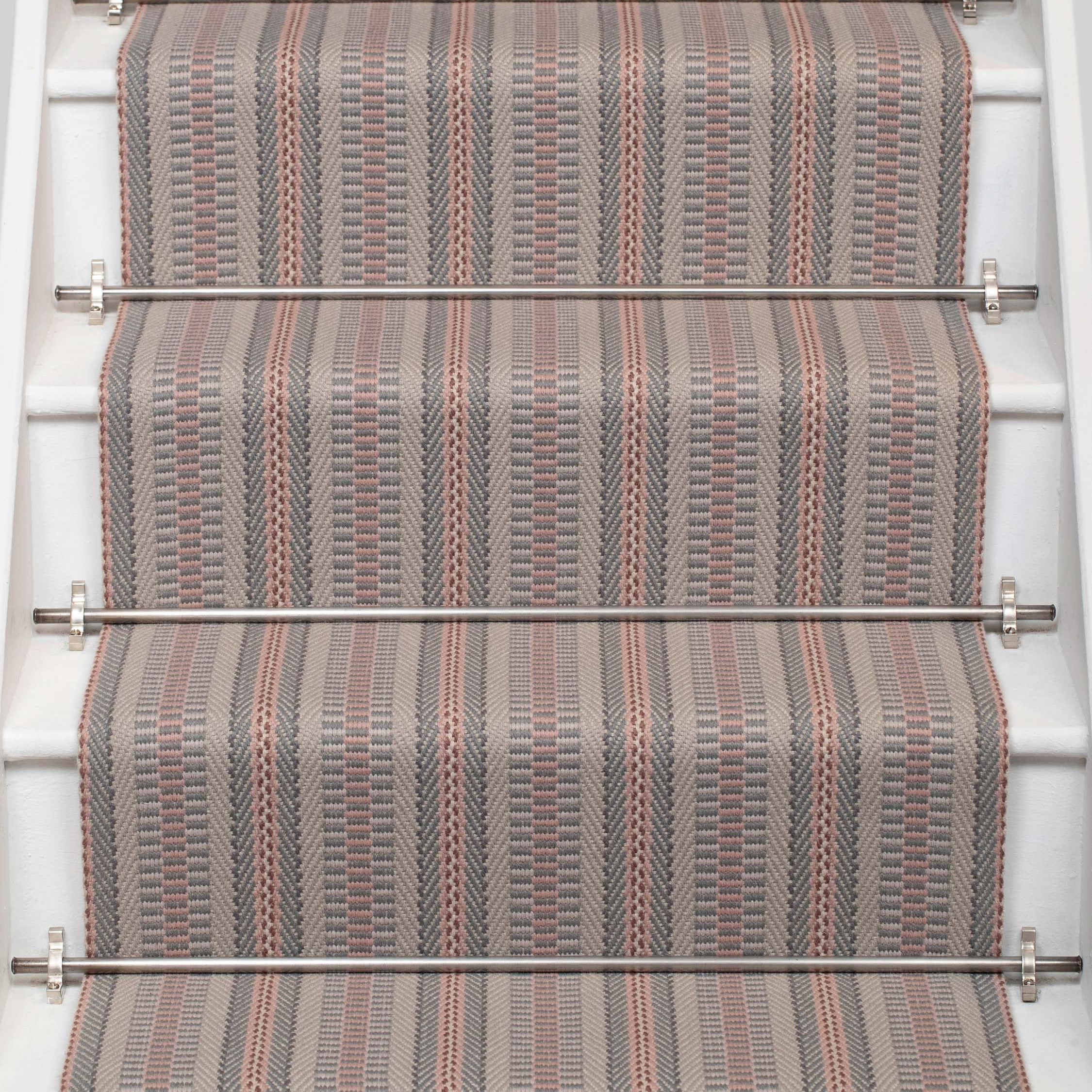 Striped flatweave runner in grey and pink on white staircase