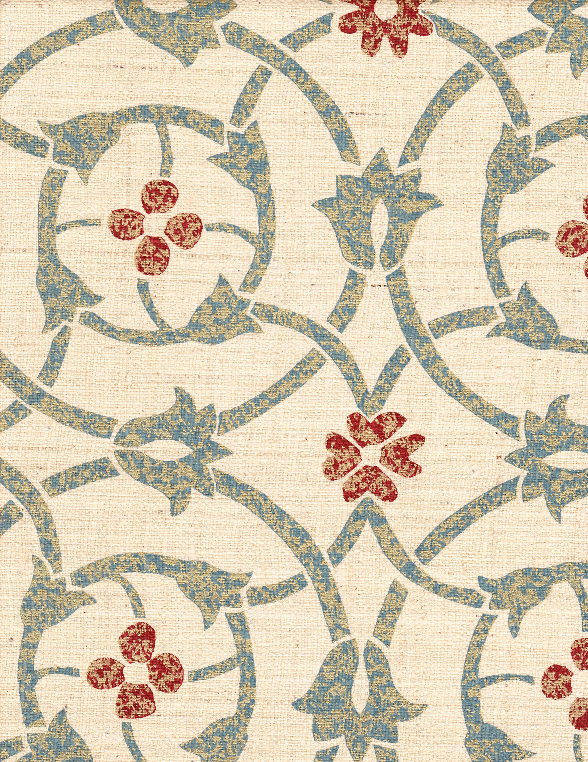 Detail of fabric in a floral lattice print in mottled blue, gray and red on a cream field.