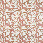 Detail of fabric in an abstract floral print in shades of pink on a cream field.