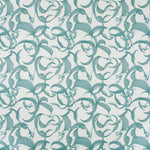 Detail of fabric in an abstract floral print in shades of blue on a cream field.